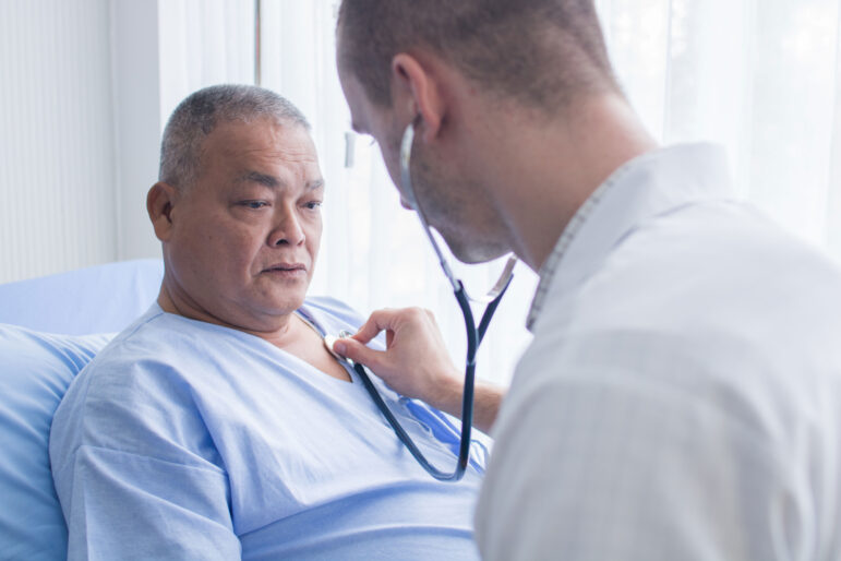 an older patient receiving a heart check up