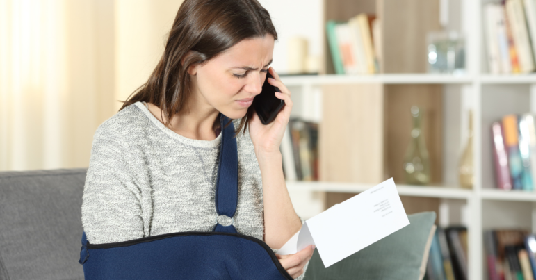 A woman in a cast calls desperately about her medical bills