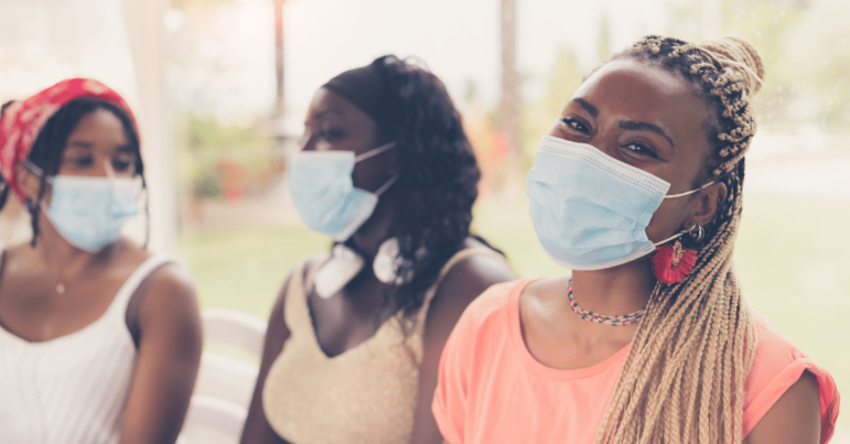 three friends with masks on